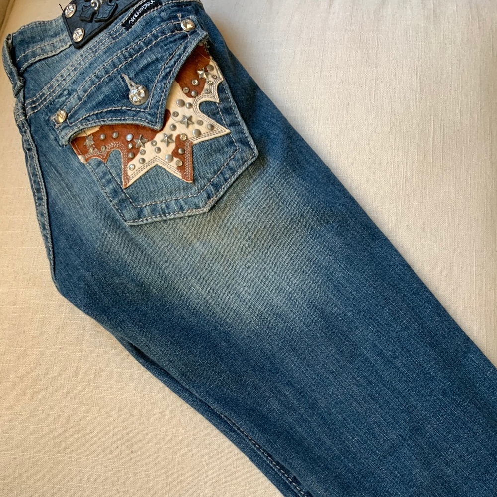 Cavender’s CowHide Miss Me jeans.